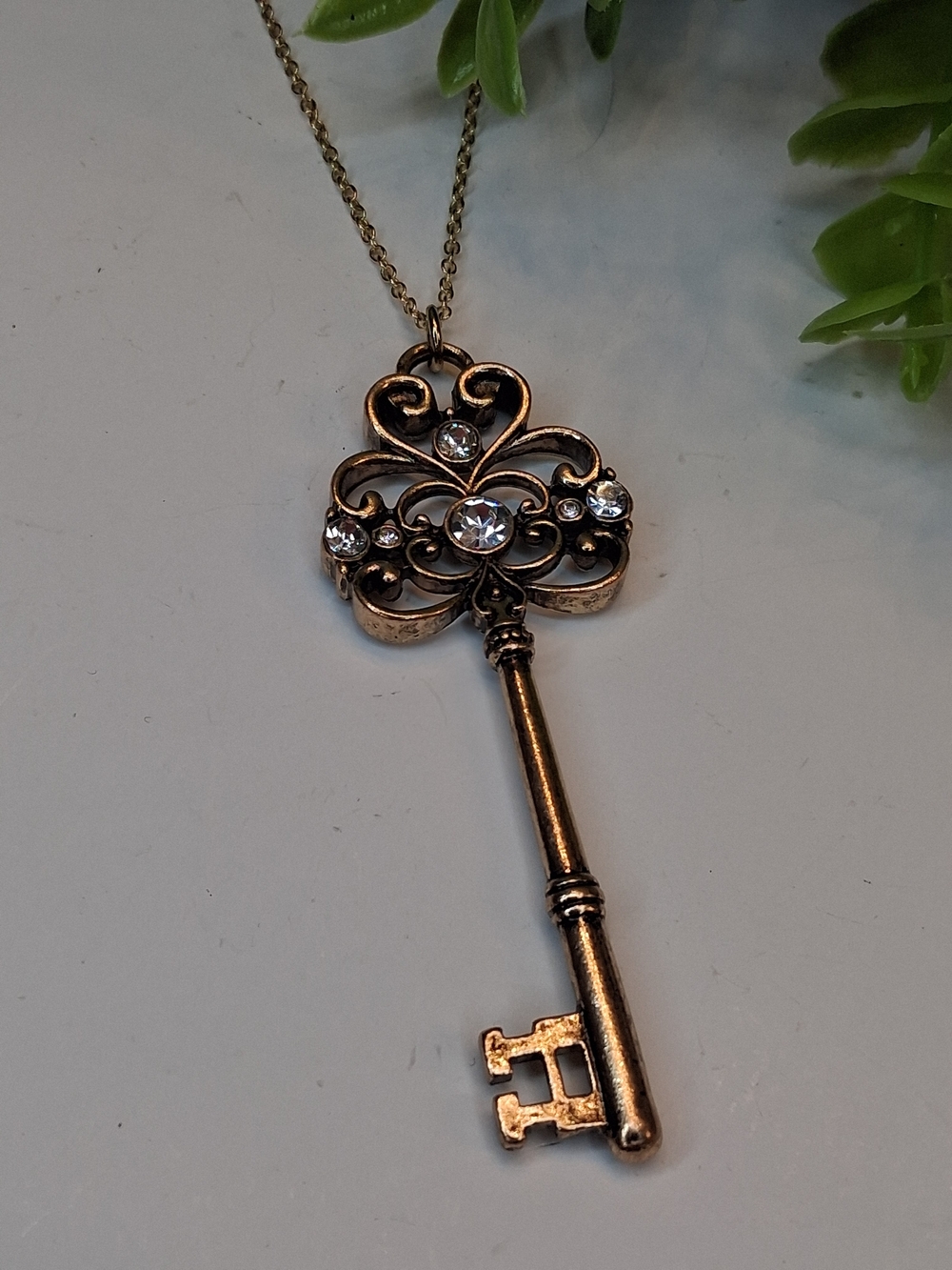 Vintage-Inspired Filigree Key Pendant Necklace with Rhinestones